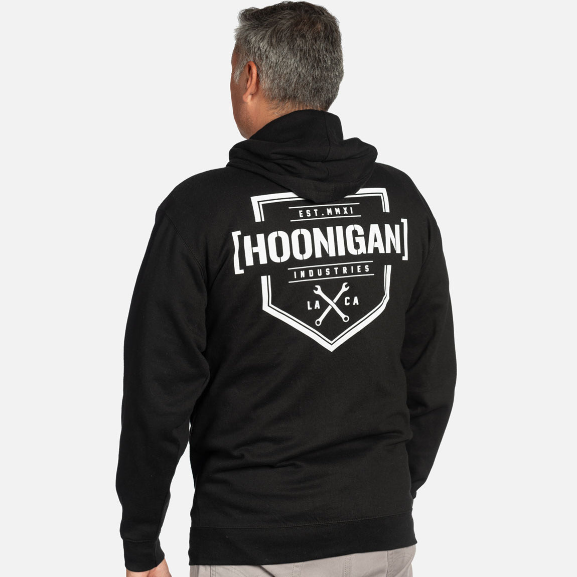 Hoonigan BRACKET X LOGO Zip Hoodie featuring a bold logo design on a black fabric background.