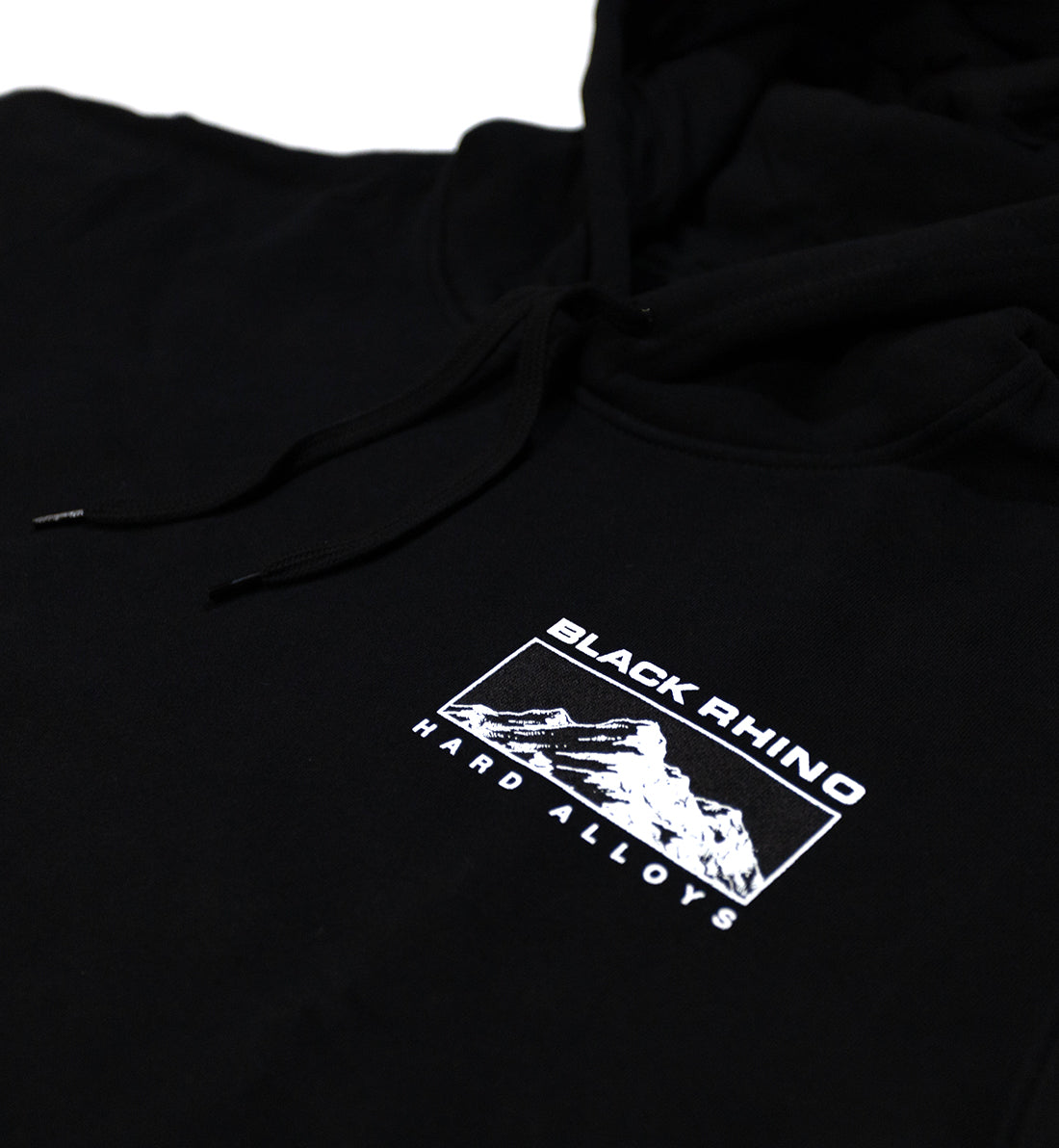 Black Rhino TRACER Hoodie in black, featuring a sleek design with a front pocket and hood, displayed on a wooden surface.
