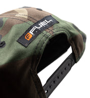 Fuel DEPARTURE Snapback Hat in black and white, featuring bold "DEPARTURE" lettering on the front and an adjustable strap at the back.