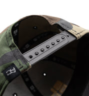 Black Rhino STACKED Snapback Hat in black with a bold logo design, featuring an adjustable fit and a flat brim.