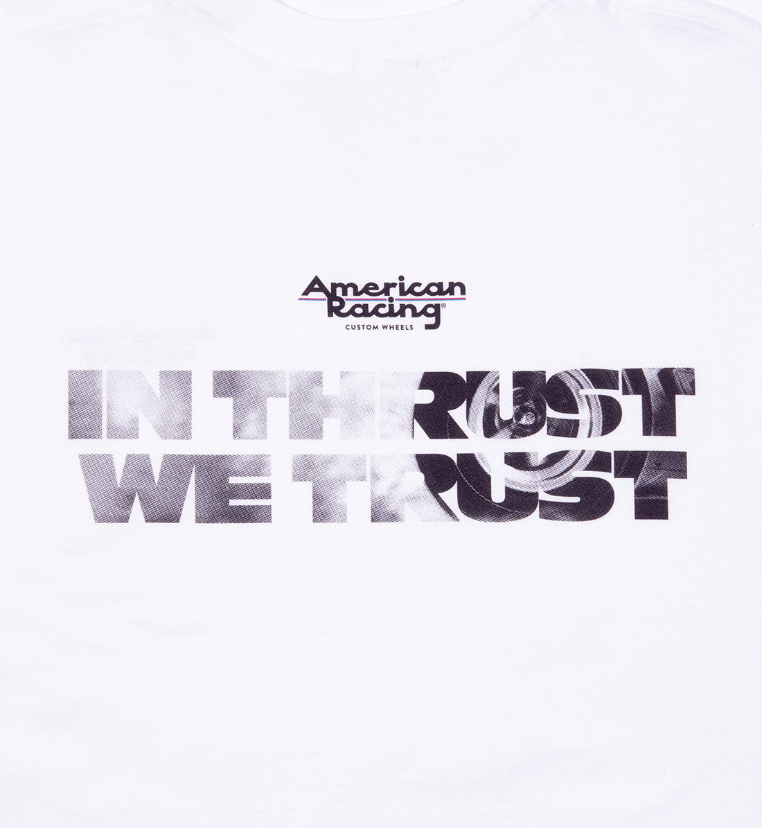 American Racing "In Thrust We Trust" short sleeve tee in white, featuring a back design with bold graphic text.