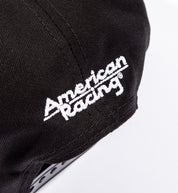 Alt text: "Black American Racing logo snapback hat showcasing back detail."