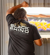 Black Rhino SUMMIT Short Sleeve Tee in gray, featuring a stylish minimalist design, displayed on a model outdoors with a natural backdrop.