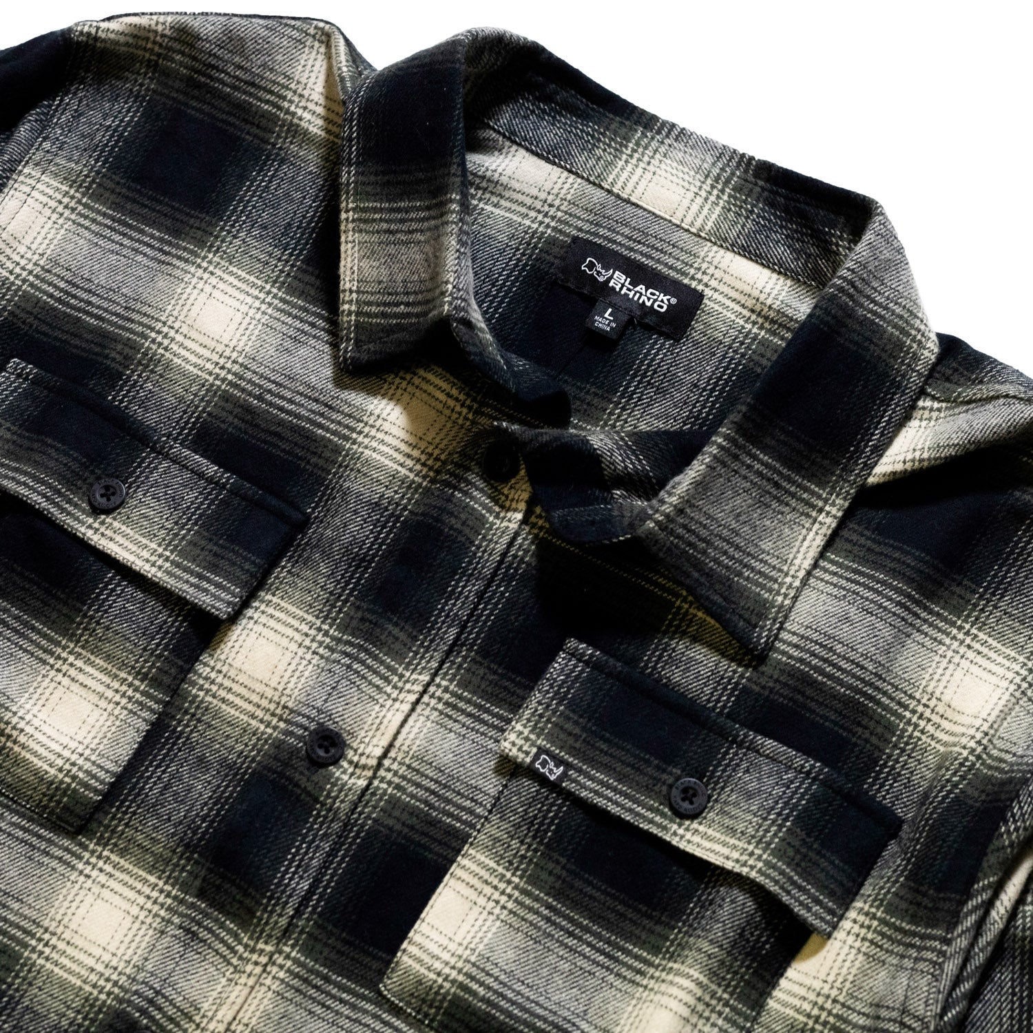 Black Rhino flannel long sleeve shirt in a plaid pattern, featuring a classic button-up front and cuffed sleeves, displayed against a neutral background.