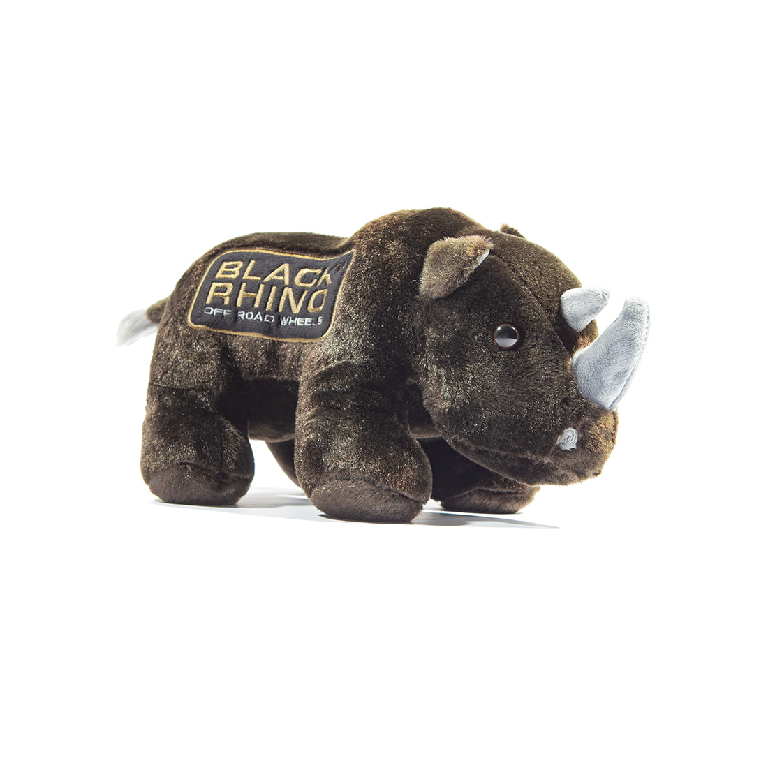 Black Rhino plush toy with soft black fur and distinct horn, sitting against a neutral background.