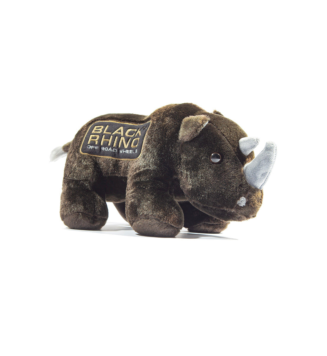 Black Rhino plush toy with soft black fur and distinct horn, sitting against a neutral background.