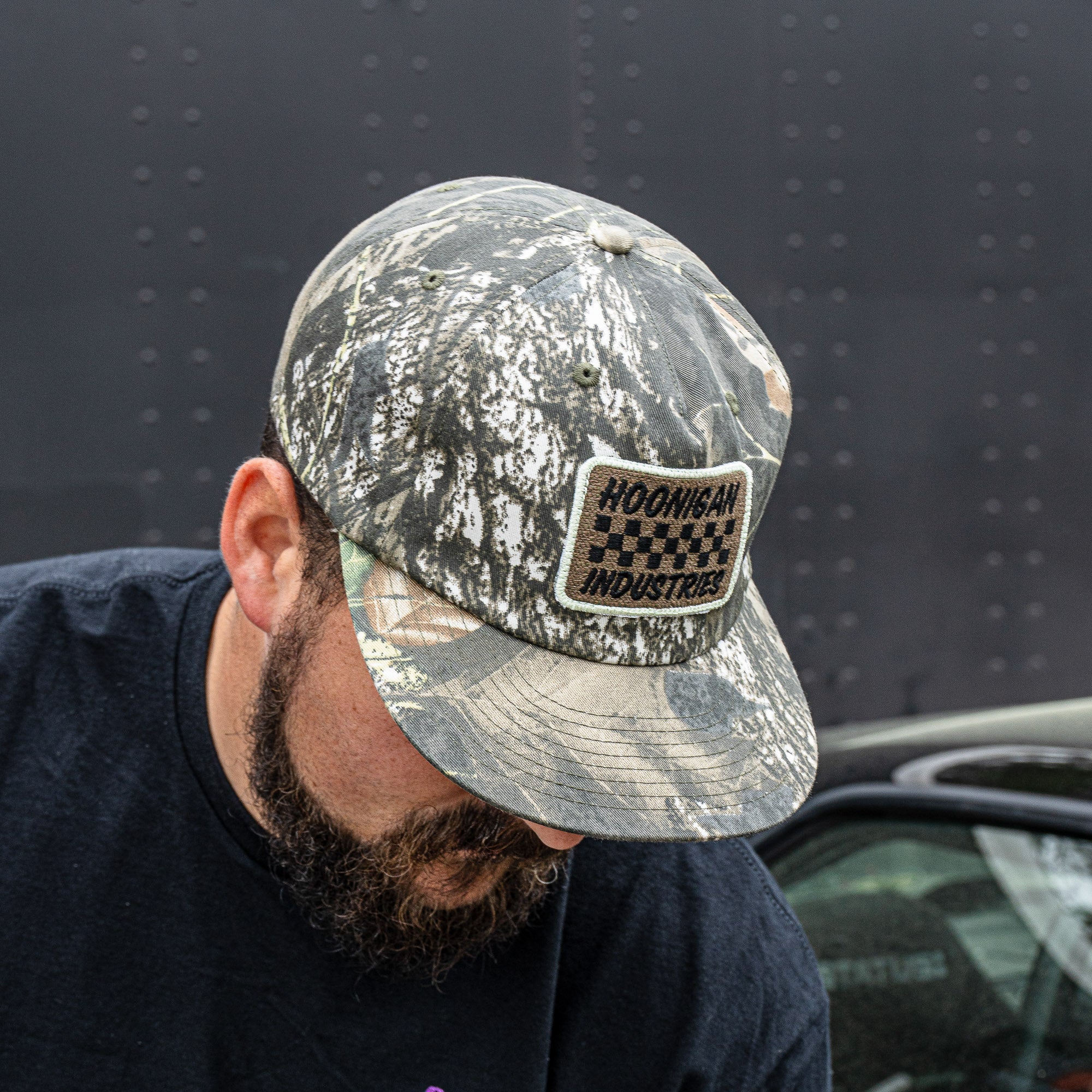Hoonigan SPRINT unstructured snapback hat in camo with embroidered logo, perfect for motorsport enthusiasts.