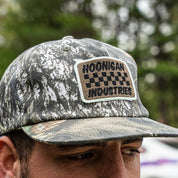 Hoonigan SPRINT unstructured snapback hat featuring a camouflage design and embroidered logo patch.