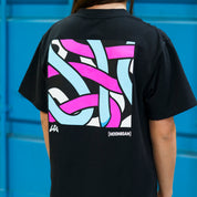 Black short sleeve tee featuring a vibrant graphic design with colorful abstract lines on the back, showcasing Hoonigan x Lia Block collaboration.