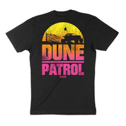 Black short sleeve t-shirt featuring a vibrant sunset design with "DUNE PATROL" text and an off-road vehicle silhouette.