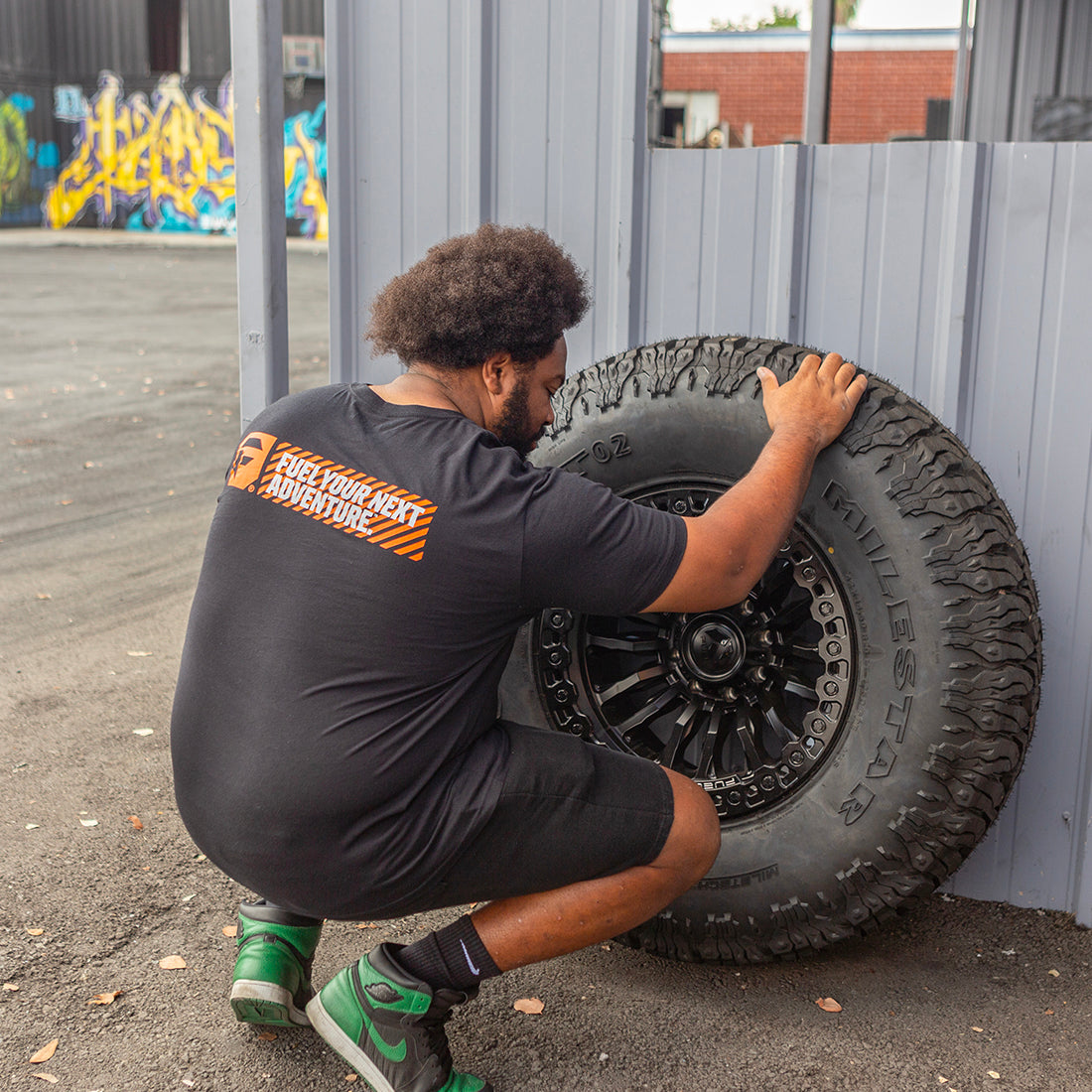 Short sleeve gray tee featuring a bold "Fuel HAZARD" graphic on the back, ideal for casual wear.