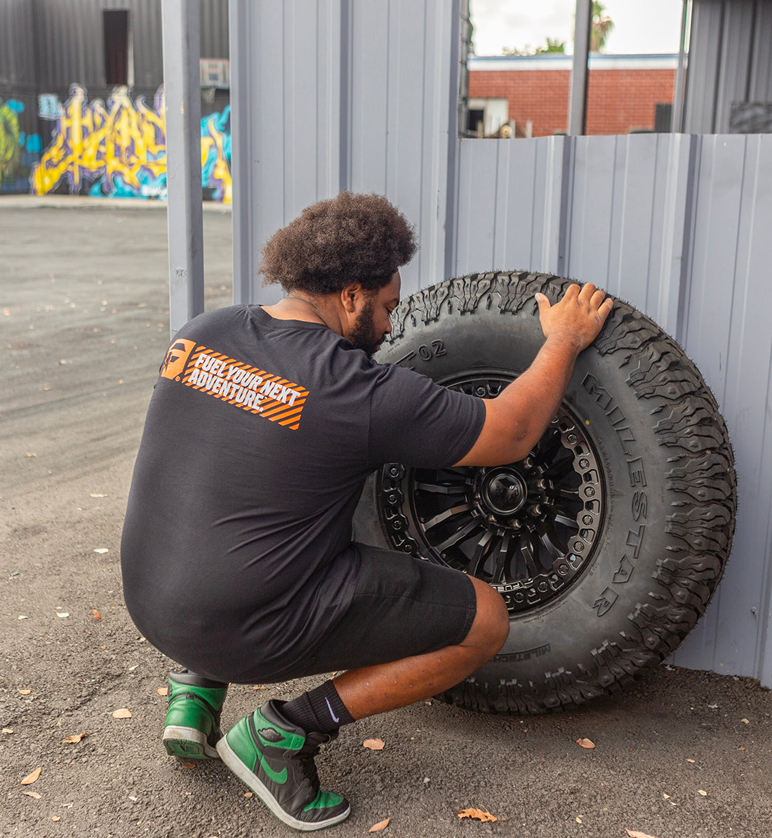 Short sleeve gray tee featuring a bold "Fuel HAZARD" graphic on the back, ideal for casual wear.