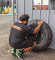 Short sleeve gray tee featuring a bold "Fuel HAZARD" graphic on the back, ideal for casual wear.