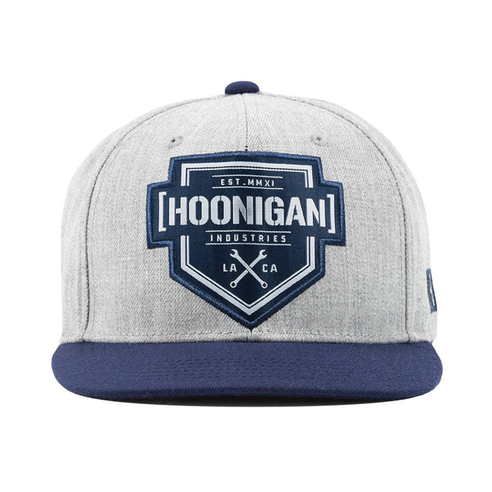 Hoonigan BRACKET X LOGO Snapback Hat in black with white logo detail on the front, featuring an adjustable strap and flat brim design.