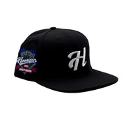 Hoonigan H LEAGUE black snapback hat with embroidered logo and adjustable strap.