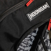 Hoonigan RATCHET STRAP Backpack featuring a durable design with adjustable straps and an edgy graphic print.