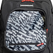 Hoonigan RATCHET STRAP Backpack featuring a durable design with adjustable straps and bold branding, ideal for outdoor and urban use.