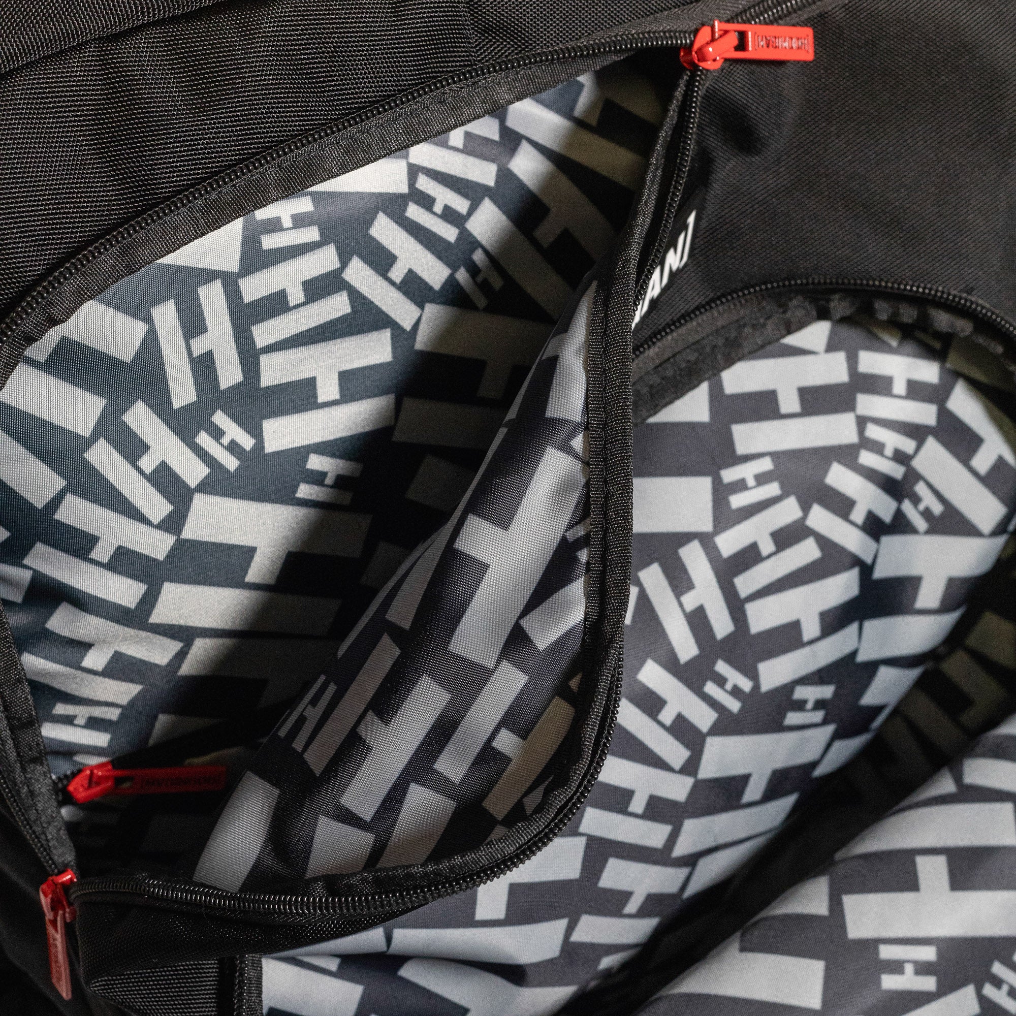 Hoonigan RATCHET STRAP Backpack featuring a durable design and ratchet strap detailing in black and yellow.