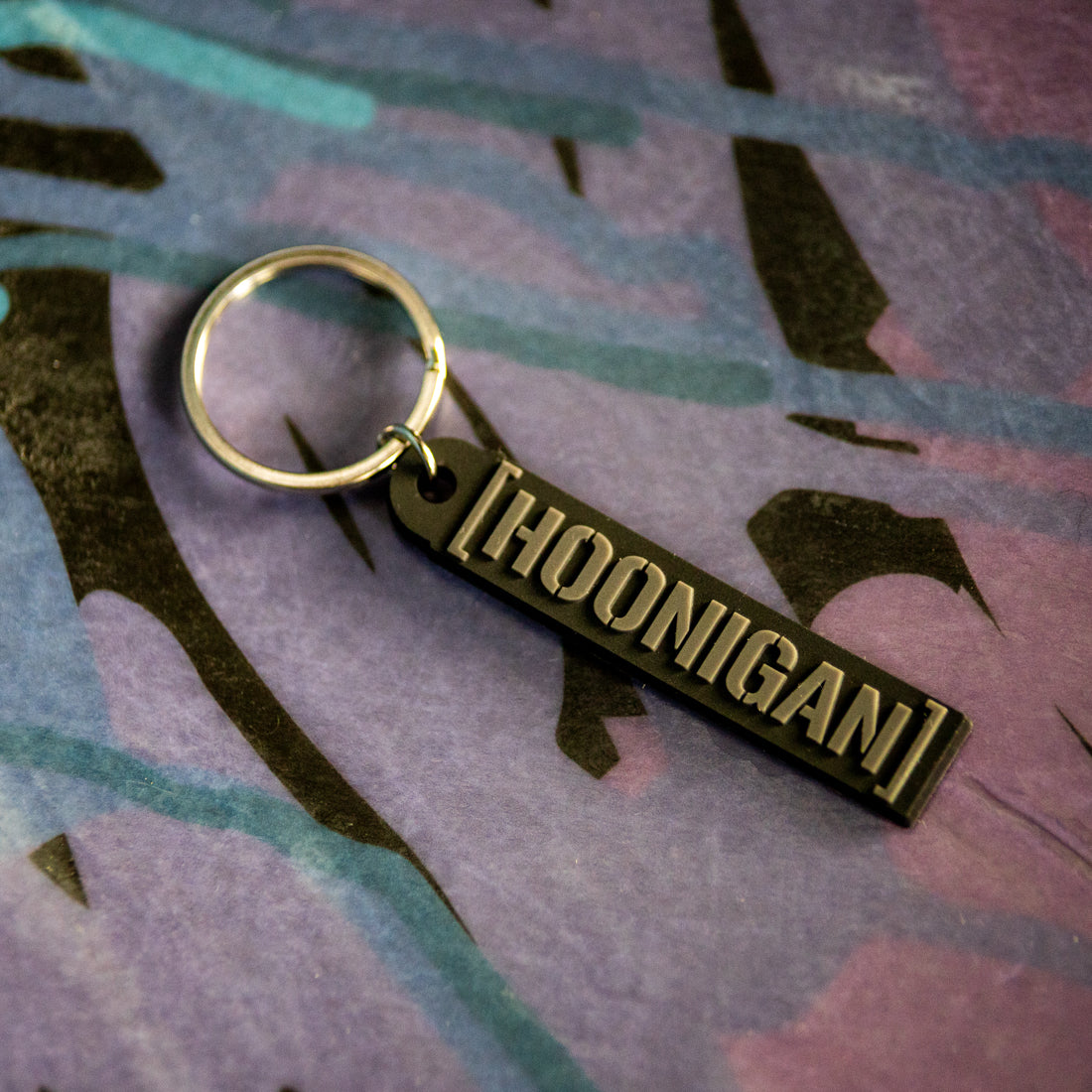 Hoonigan CENSOR BAR rubber keychain featuring a bold black design on a gray background.