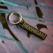 Hoonigan CENSOR BAR rubber keychain featuring a bold black design on a gray background.