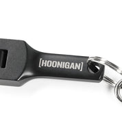 Hoonigan FOUND IT Keychain featuring a sleek black design with the brand name engraved for automotive enthusiasts.