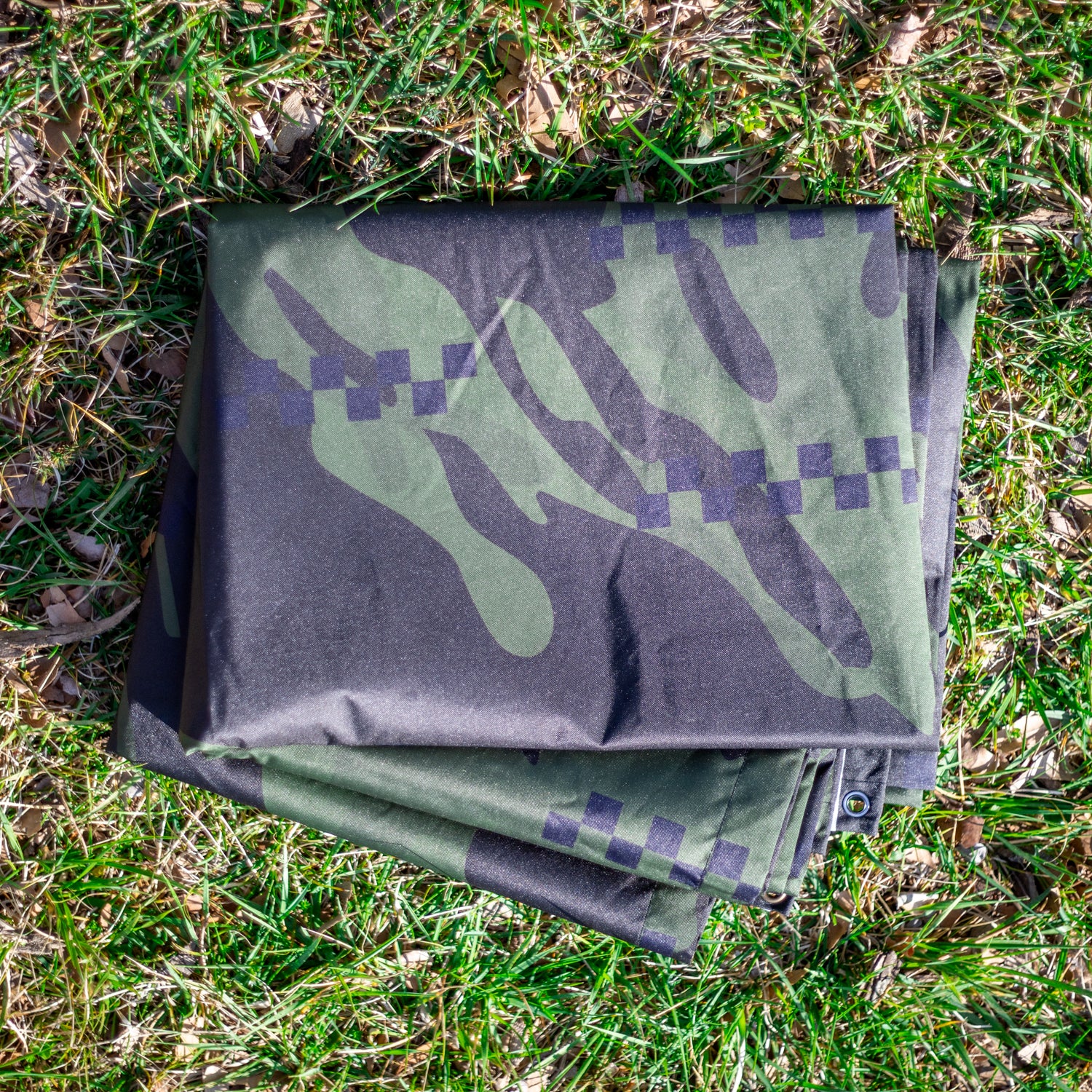 Hoonigan DISTRUPTIVE Nylon Tarp featuring a vibrant design, durable fabric, and reinforced edges, ideal for outdoor use and versatile applications.