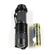 Black safety flashlight with knurled grip and a yellow battery, part of the Hoonigan OH SH*T Safety Kit.
