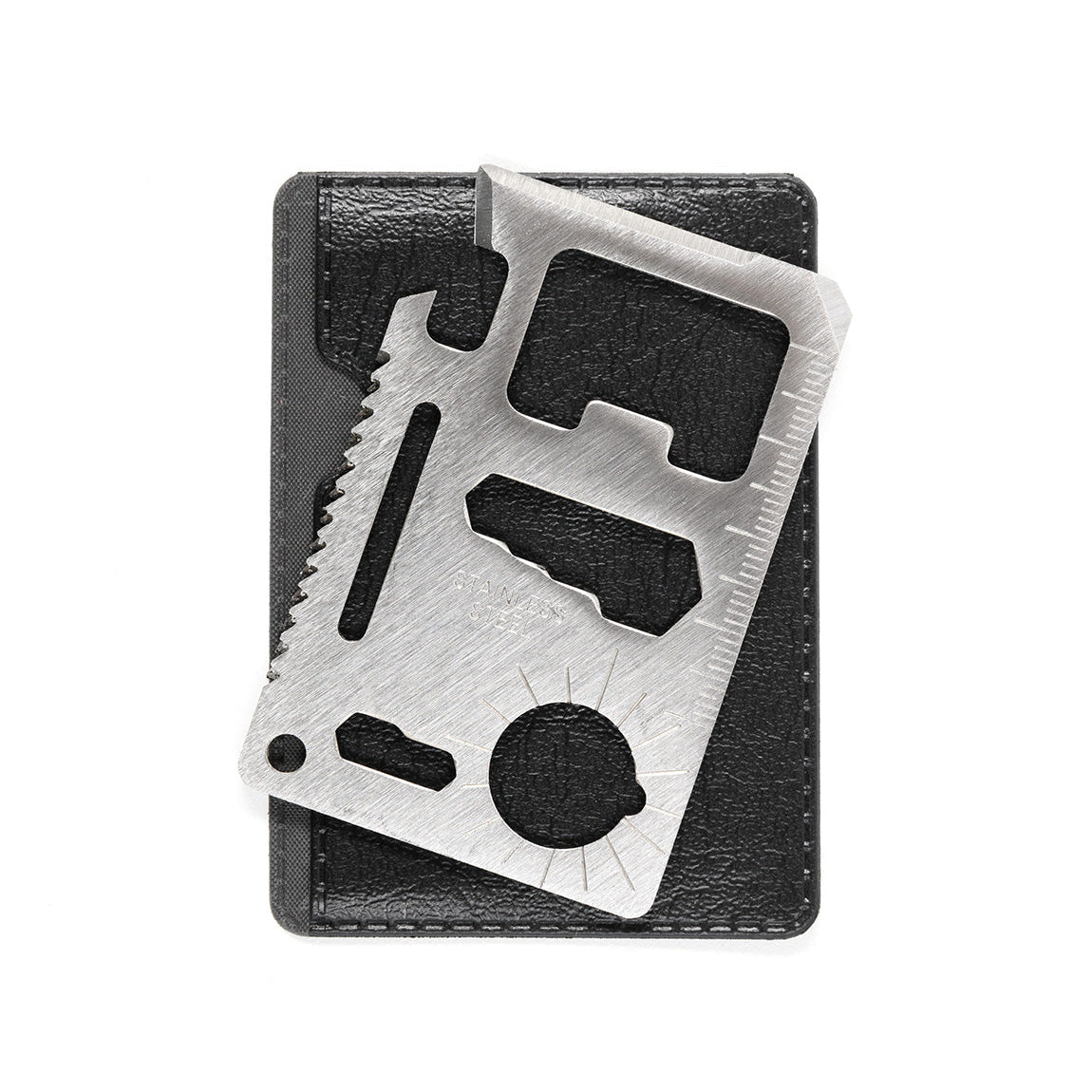 Stainless steel Hoonigan OH SH*T Safety Kit multi-tool with ruler, saw, and bottle opener, displayed on a black case.