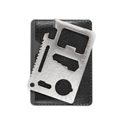 Stainless steel Hoonigan OH SH*T Safety Kit multi-tool with ruler, saw, and bottle opener, displayed on a black case.