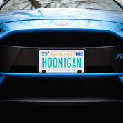 Hoonigan OG FLORIDA License Plate featuring a bold graphic design with the word "Hoonigan" in vibrant colors on a yellow background.