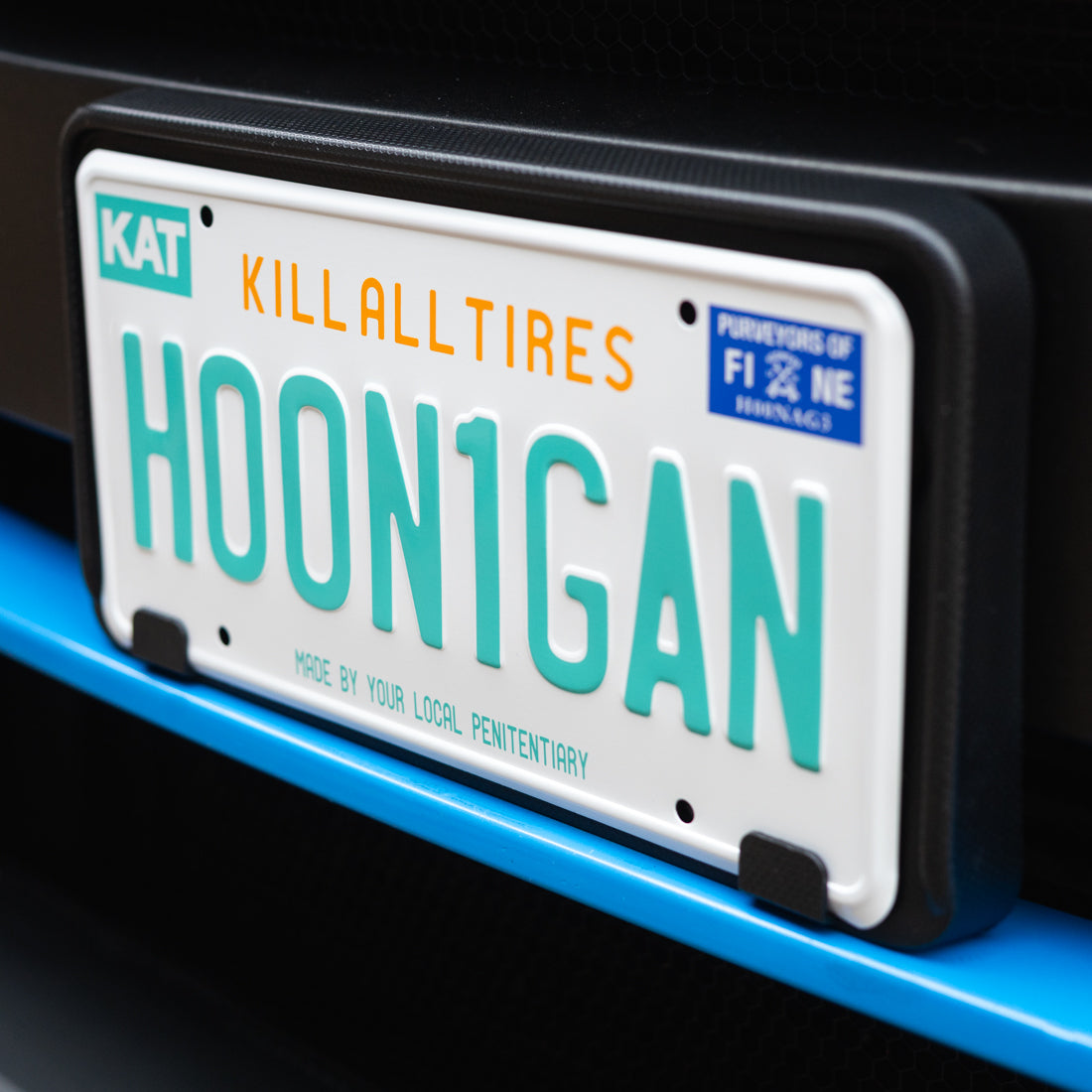 Hoonigan OG Florida license plate with bold black lettering and a white background, featuring iconic Hoonigan branding.