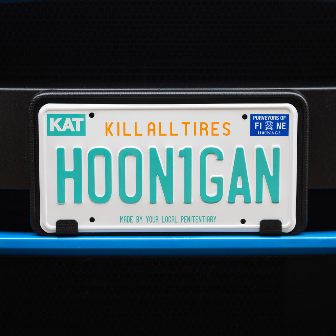 Hoonigan OG Florida license plate featuring bold graphics and text on a vibrant background.