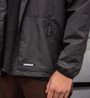Hoonigan STANDARD ISSUE windbreaker jacket featuring a black and white design, front detail view.