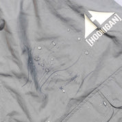 Gray Hoonigan H.A.V.O.C. rain-activated cargo shorts with water droplets, logo, and topographic map design.