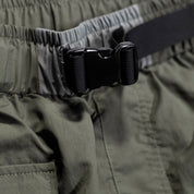Close-up of Hoonigan H.A.V.O.C. rain-activated cargo shorts with adjustable waistband and durable buckle detail.