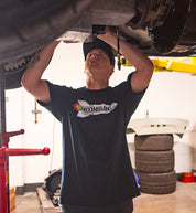 Hoonigan ROCKET Short Sleeve Tee in a lifestyle setting, featuring bold graphics and a relaxed fit on a model outdoors.