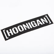Hoonigan New Standard Bar Short Sleeve Tee in black with bold white logo print, displayed on a flat surface.