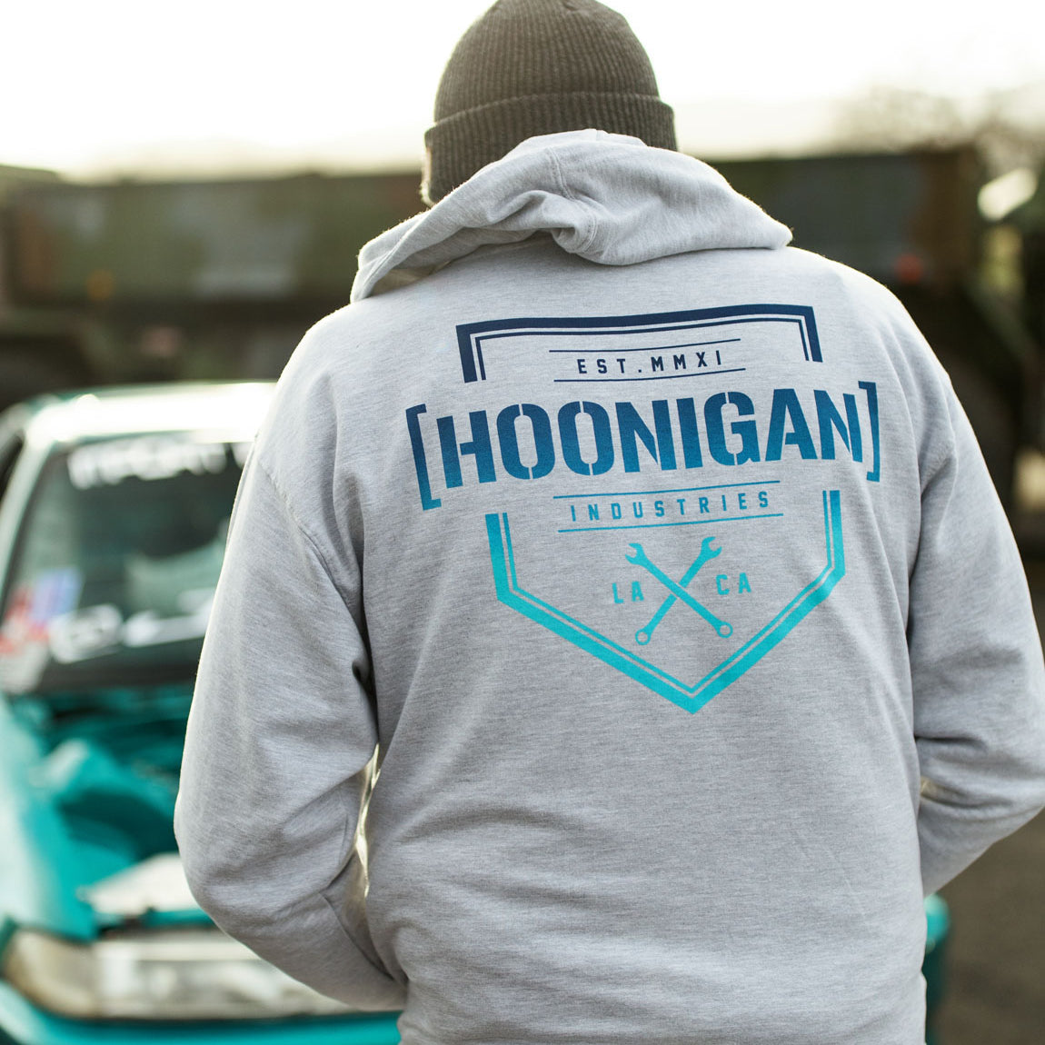 Hoonigan BRACKET X LOGO Zip Hoodie in black, featuring a large logo print on the front and a zipper closure.