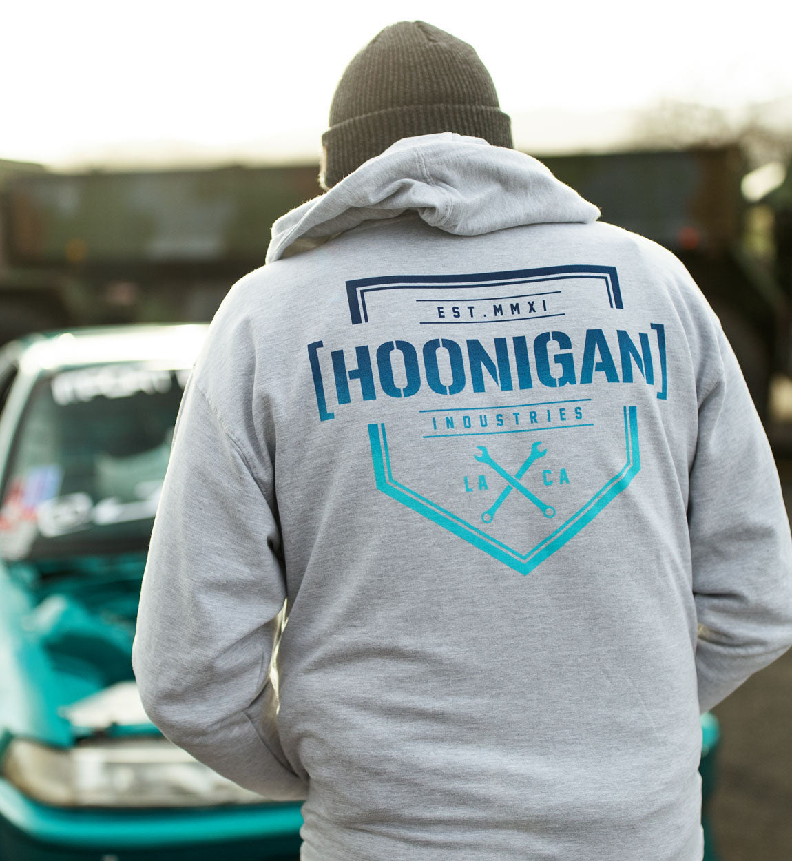 Hoonigan BRACKET X LOGO Zip Hoodie in black, featuring a large logo print on the front and a zipper closure.