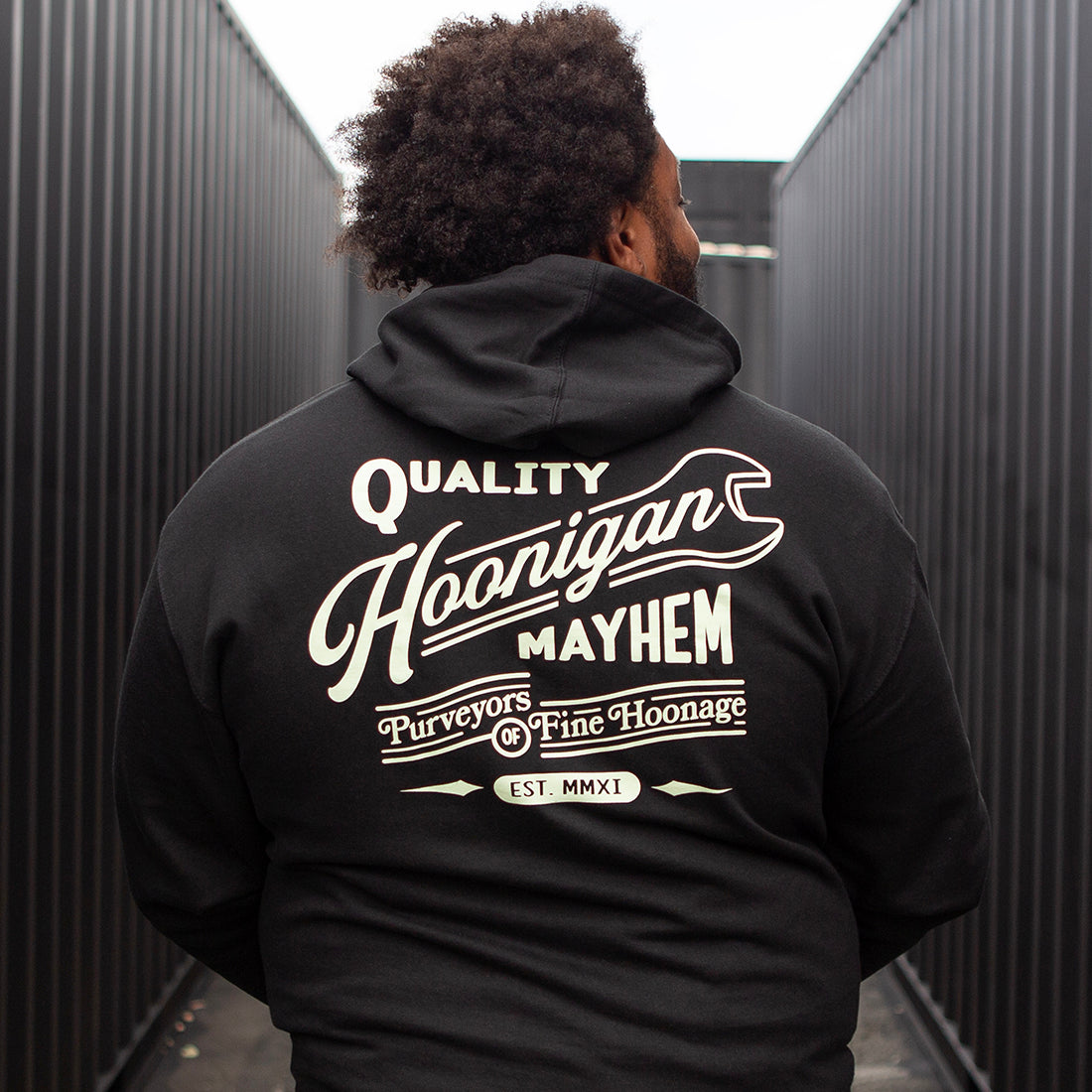 Hoonigan BACKDATE pullover hoodie in black, featuring a graphic logo design on the back and a comfortable fit.