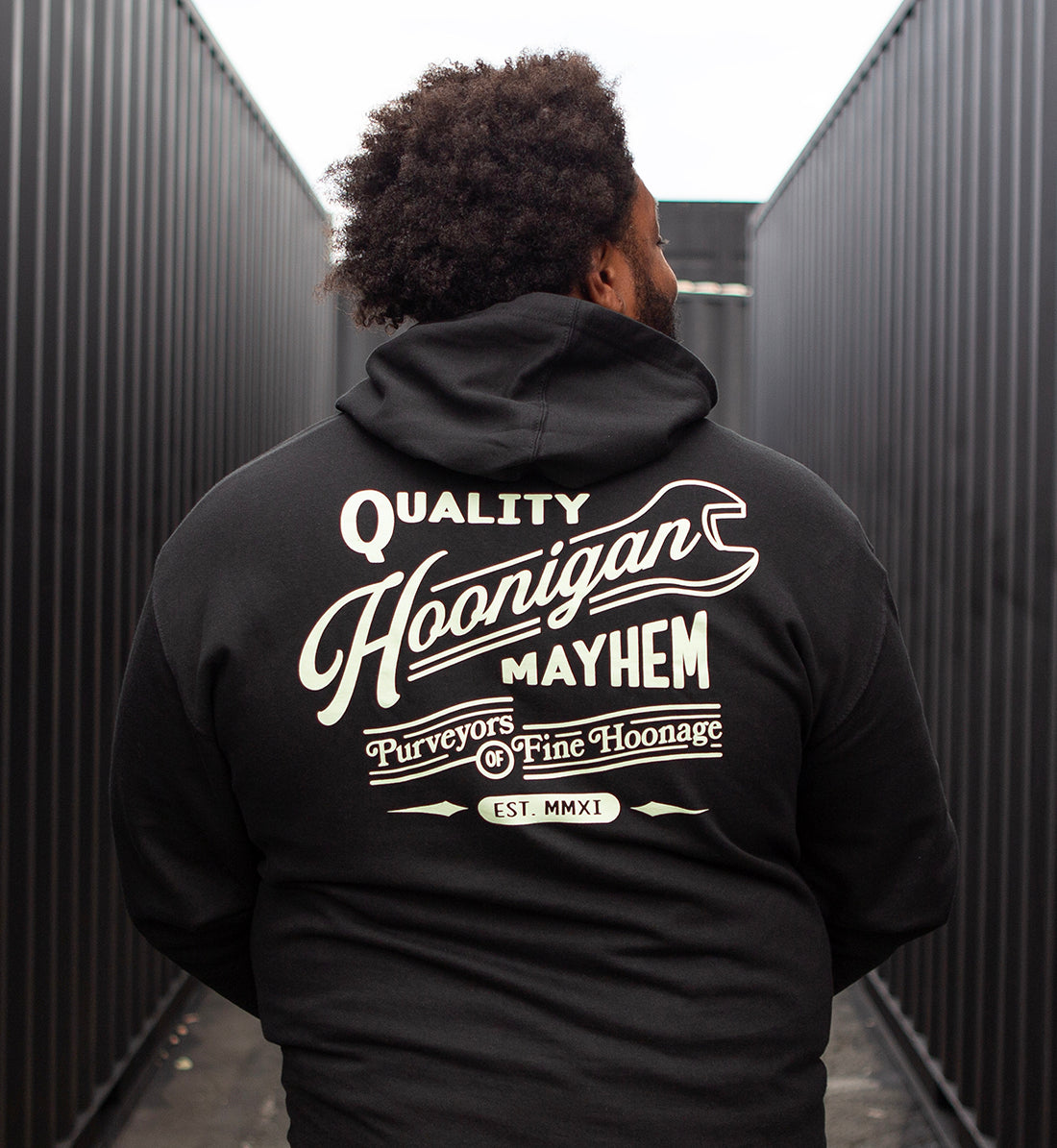 Hoonigan BACKDATE pullover hoodie in black, featuring a graphic logo design on the back and a comfortable fit.
