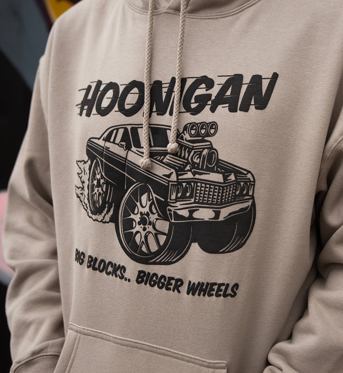 Hoonigan RIDONKULOUS pullover hoodie in black with a bold graphic logo on the front, modeled against an urban backdrop.
