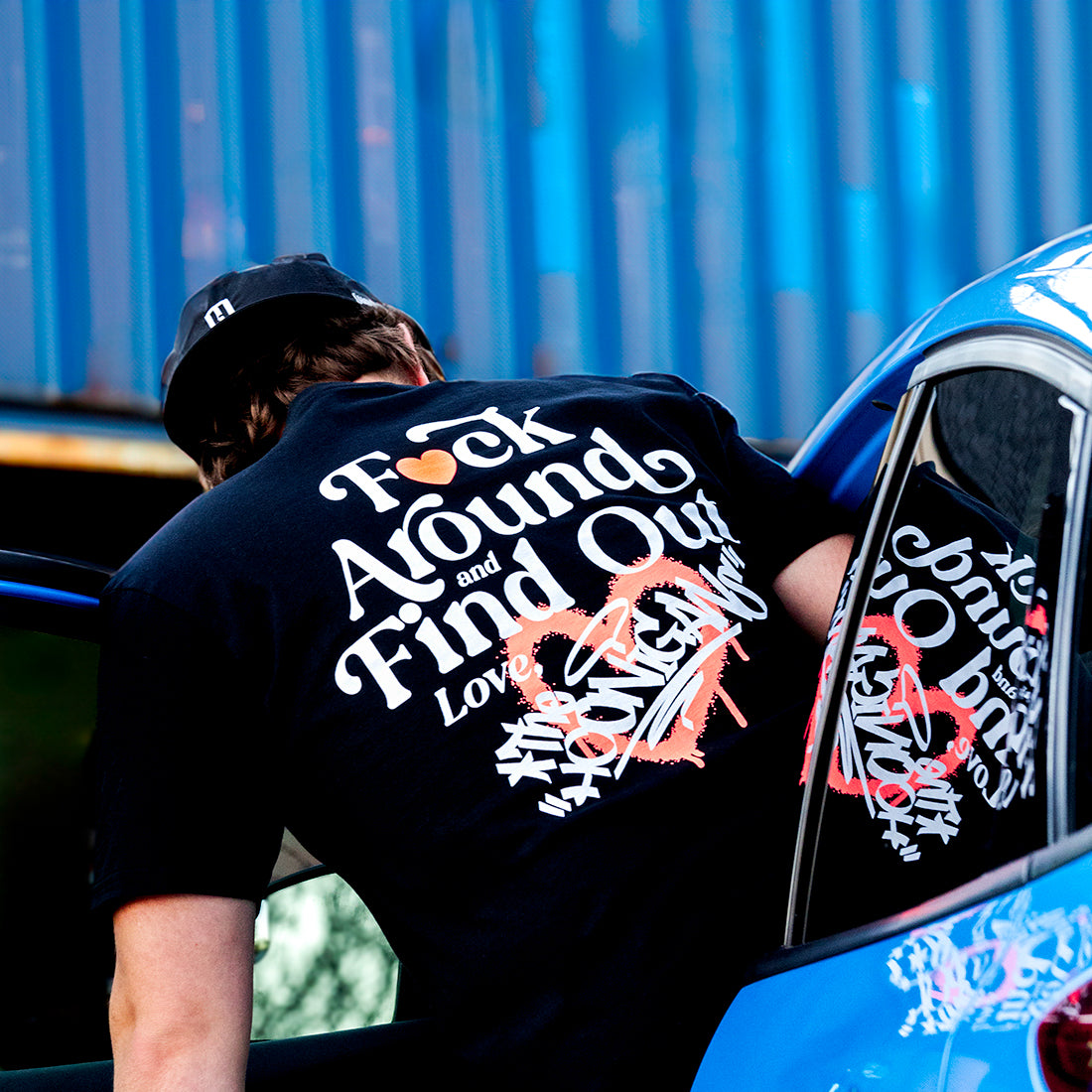 Black short sleeve tee featuring the Hoonigan logo in bold white text on the front, designed for a casual streetwear look.