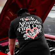 Hoonigan FIND OUT Short Sleeve Tee in black featuring bold white graphics on the front and back.