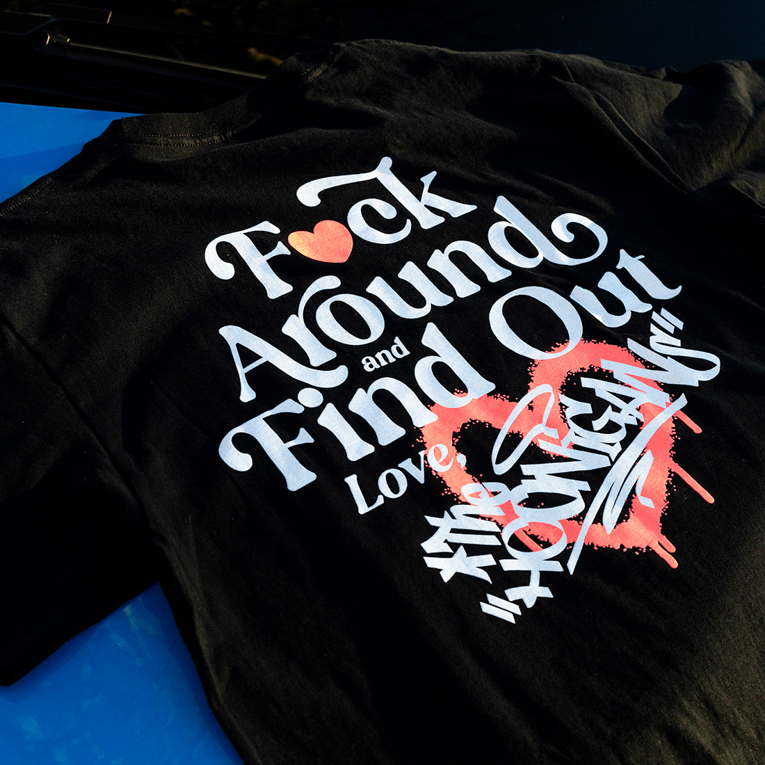 Hoonigan FIND OUT Short Sleeve Tee featuring a bold graphic logo on a black cotton fabric.