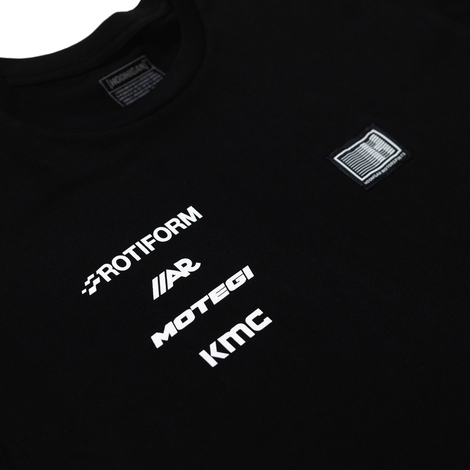 Hoonigan Motorsports black short sleeve tee featuring a bold graphic logo on the front.