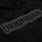 Hoonigan AIRBAGS CENSOR BAR Pullover Hoodie in black featuring a bold graphic design on the front.
