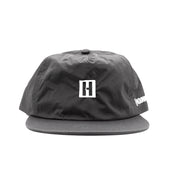 Hoonigan TIRE SLAYER unstructured snapback cap featuring a bold logo and a relaxed fit, ideal for casual wear and motorsport enthusiasts.