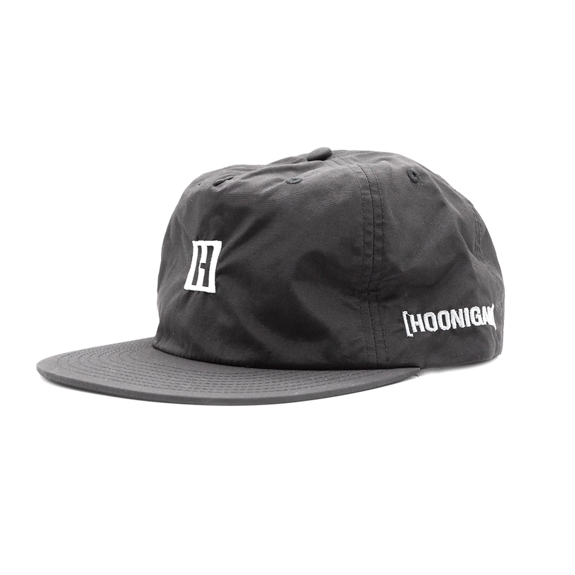 Hoonigan TIRE SLAYER unstructured snapback cap featuring a black and white design with a prominent logo on the front.