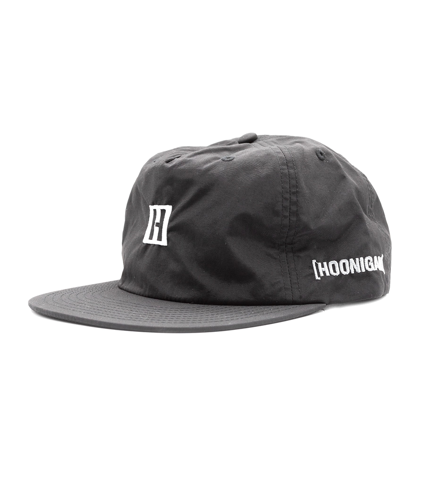 Hoonigan TIRE SLAYER unstructured snapback cap featuring a black and white design with a prominent logo on the front.